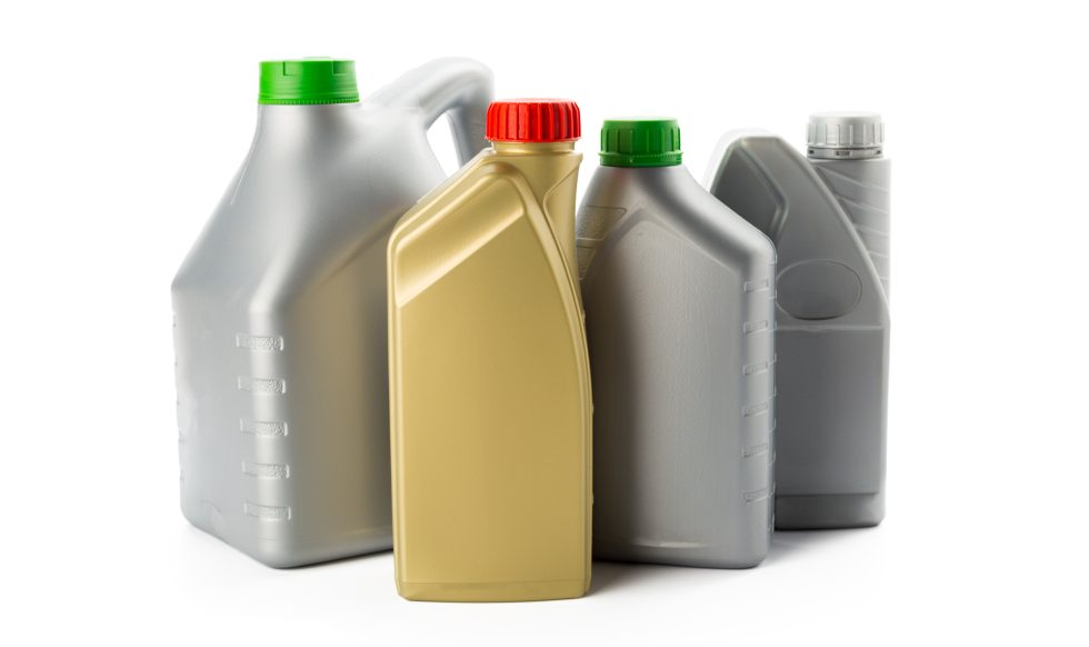 Plastic bottles from automobile oils isolated on white